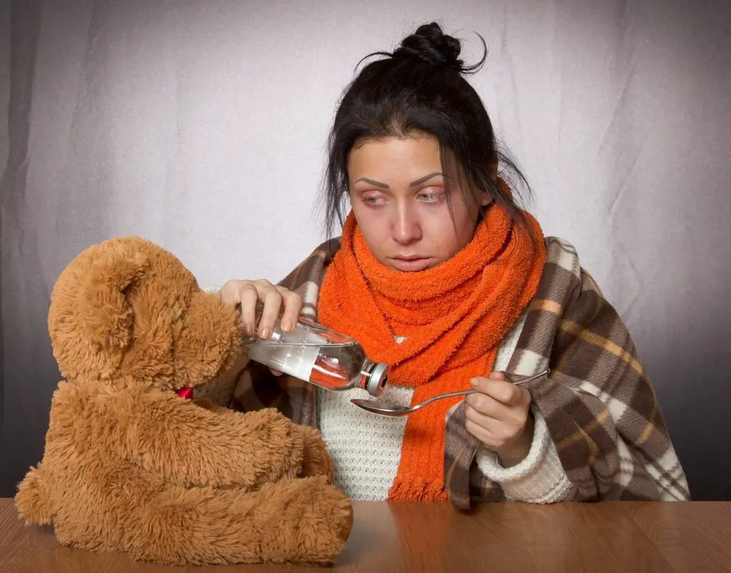Sick with covid - woman with her Teddy Bear