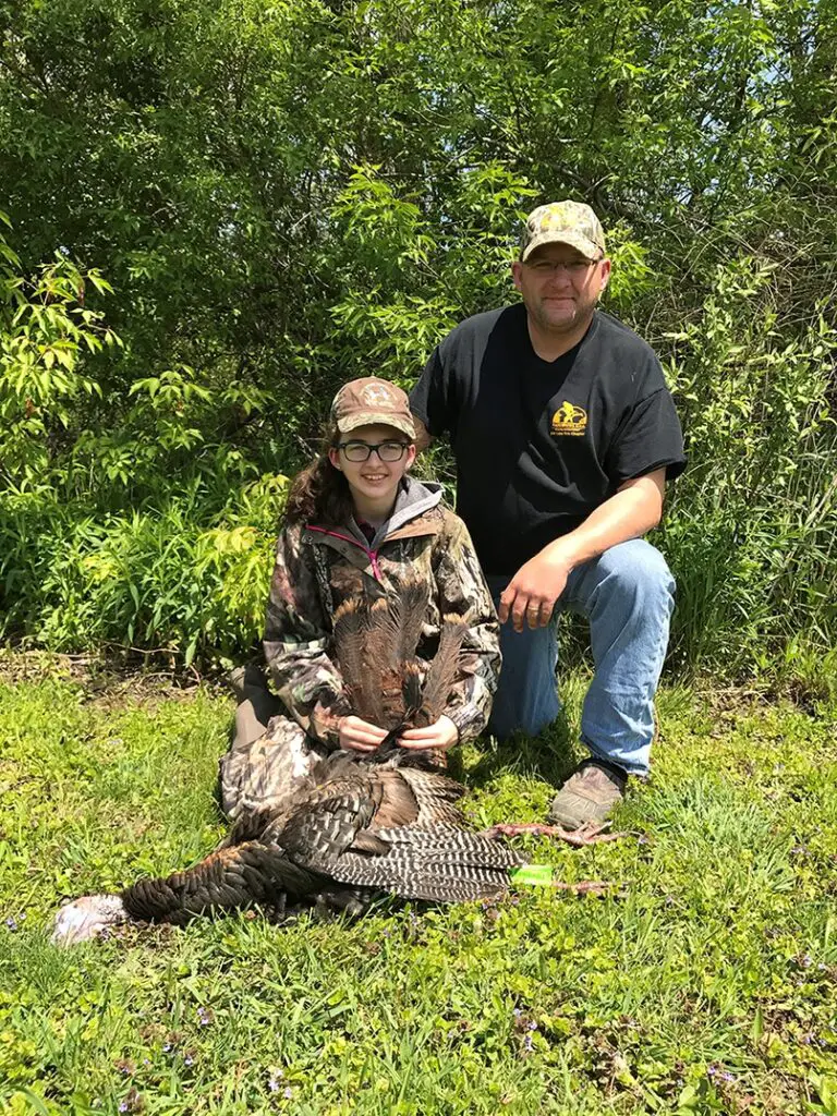 Joe Robison and his daughter, Sidney pose with Sidney’s spring turkey. Hunters in Michigan have opportunities to shoot turkeys in the spring and fall.