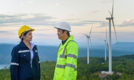 Workers at wind farm - invest in wind energy
