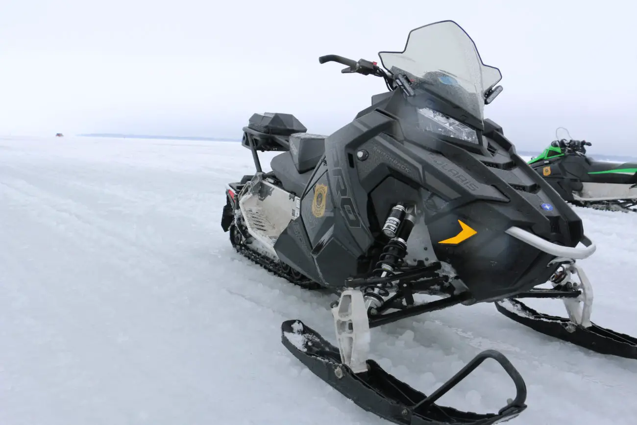 Snowmobile on Ice Michigan Conservation Officer