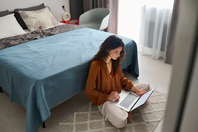 Self-employed individual examining tax deductions on a laptop.