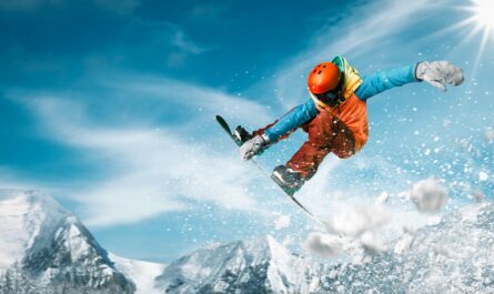 Snowboarder equipped with essential snowboarding gear, ready to conquer the snowy slopes.