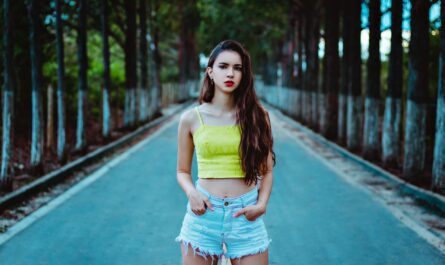 A trendy woman confidently rocking high-waisted shorts, exemplifying High-Waisted Shorts Styling.