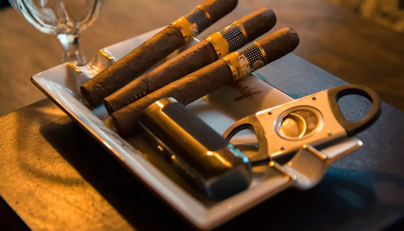 A collection of premium cigar accessories online featuring cutters, lighters, humidors, and travel cases.