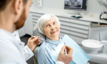A smiling senior receiving dental care, highlighting Senior Dental Care in Falls Church