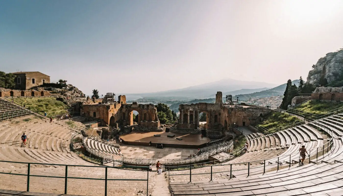 A panoramic view of Taormina, showcasing its iconic landmarks and stunning coastline.