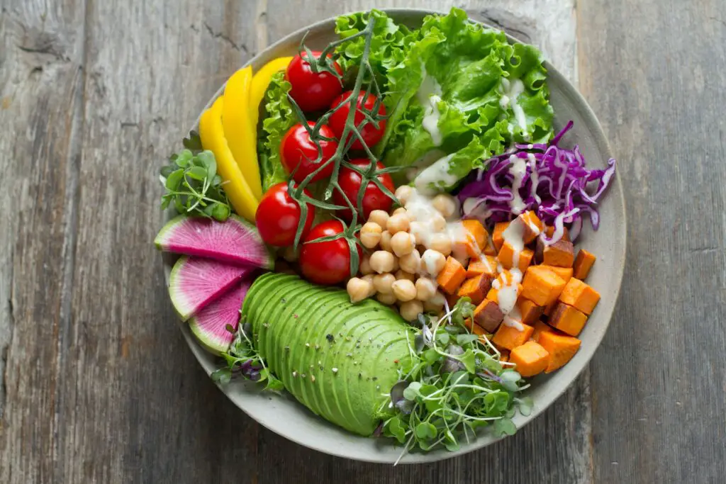 a bowl of food on a wood table