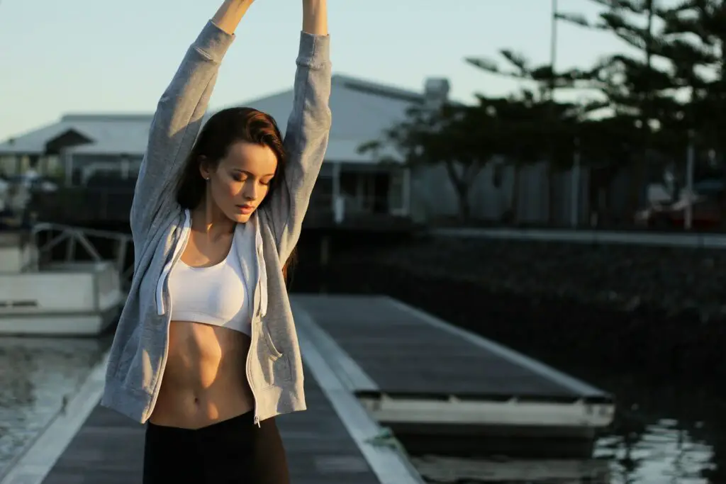 a woman stretching her arms